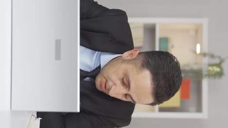 Vertical-video-of-Home-office-worker-man-is-sick-and-coughing.